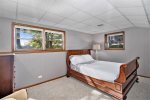 Lower level king bedroom. Please note: a twin daybed and trundle have been added to this room